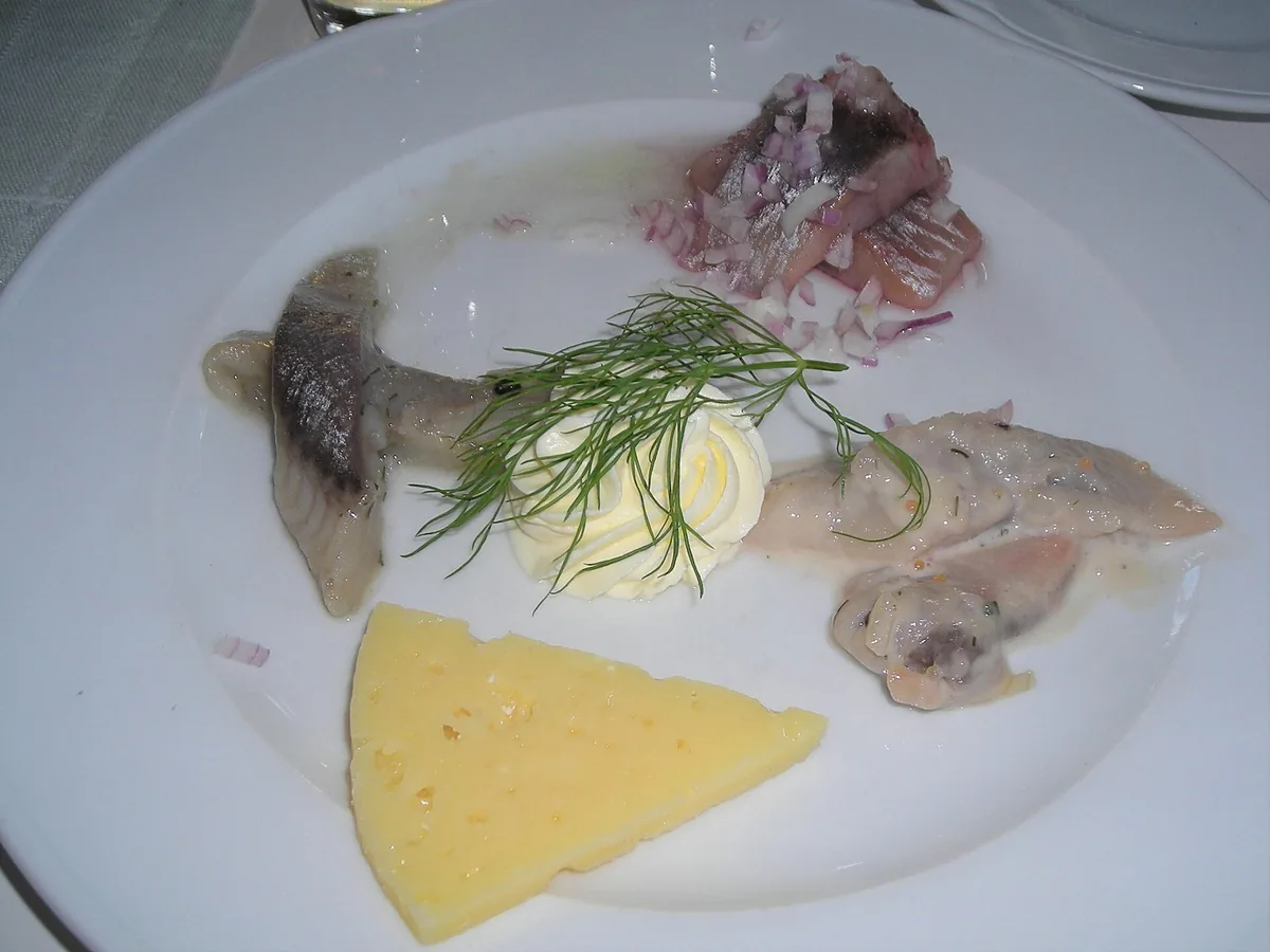 Herring fillet with dill on a plate